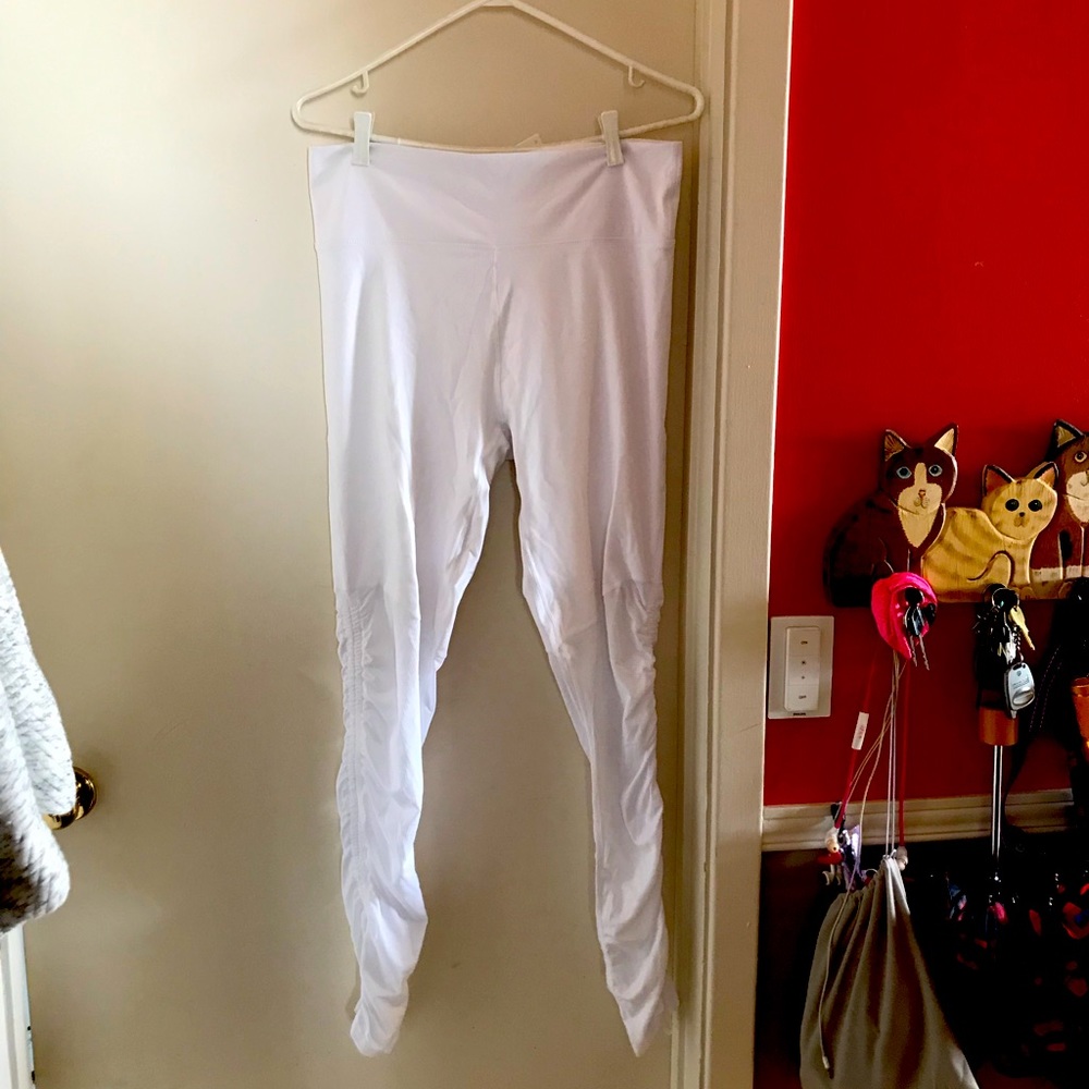 White leggings with transparent bottoms. May be cinched to be capris.